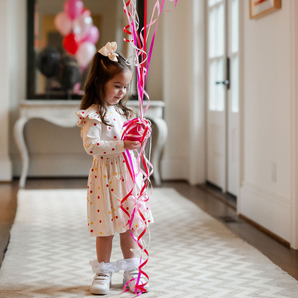 little girls play dress with polka dots