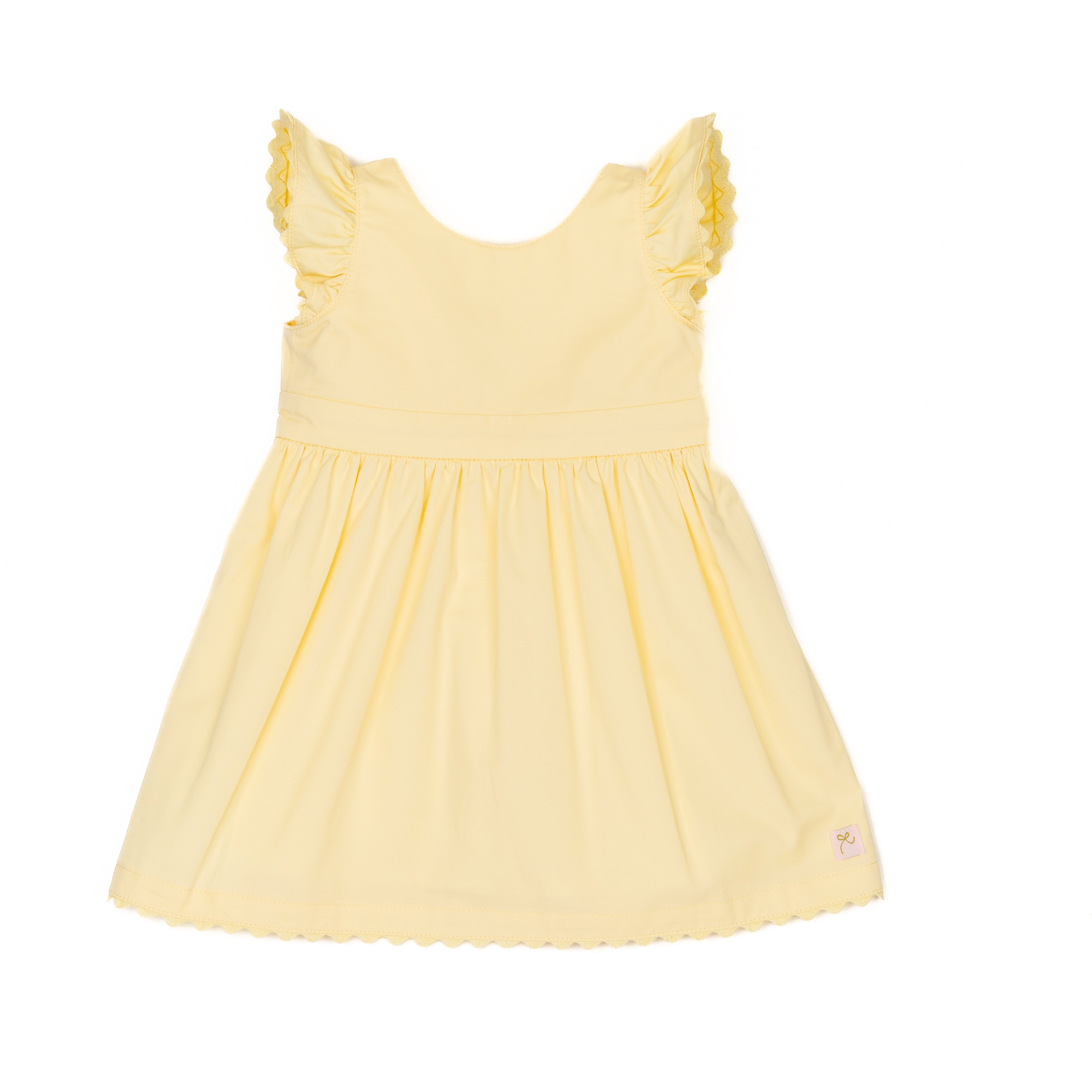Yellow dress with ruffled sleeves and ric rac trim