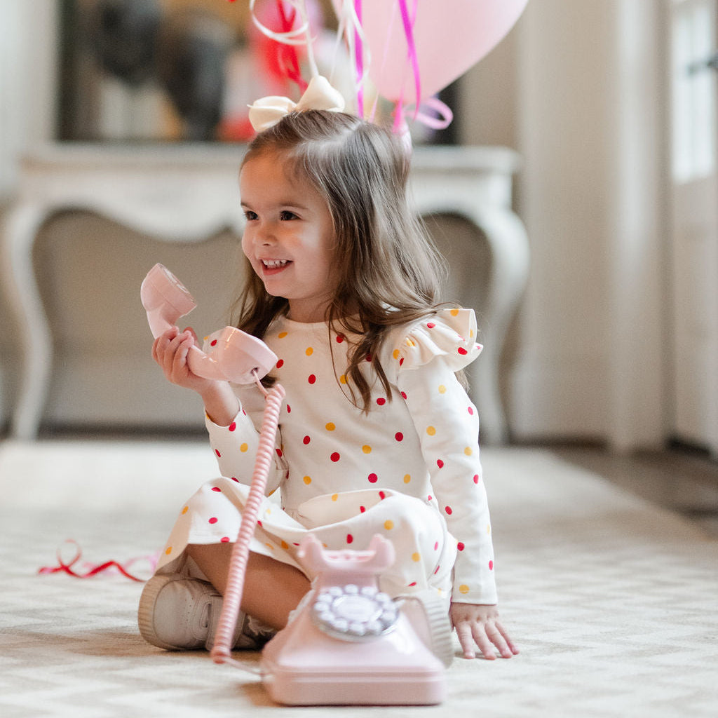 little girls play dress with polka dots