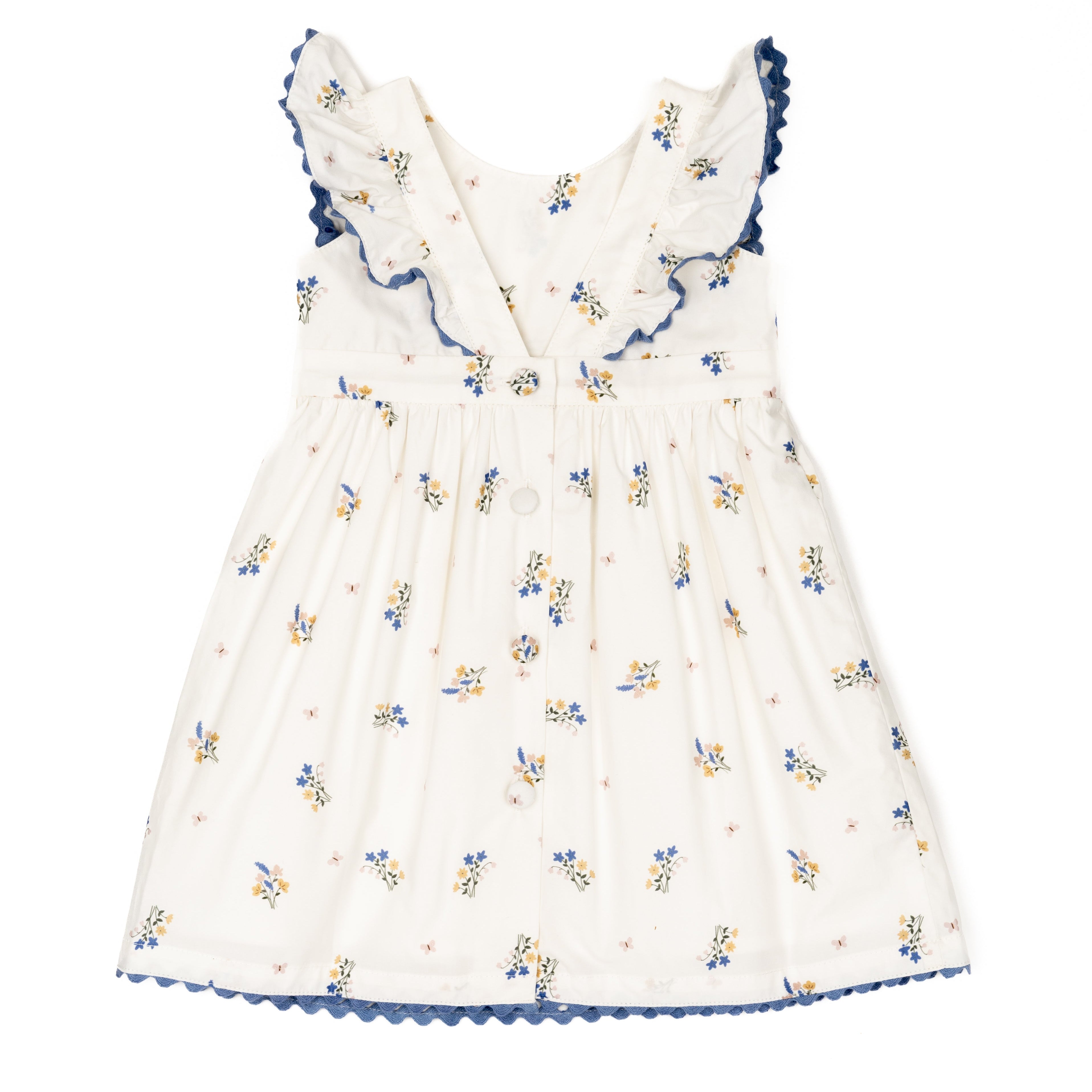 White dress with blue floral pattern on a white background